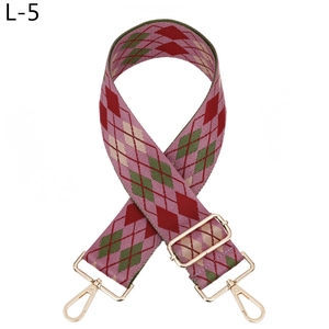 Close-up of adjustable jacquard strap featuring colorful argyle patterns and gold hardware