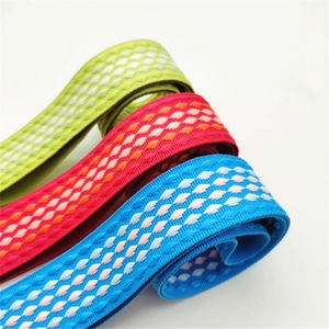 Close-up of adjustable woven shoulder straps with green, red and blue diamond patterns