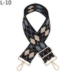 Detail of adjustable Argyle pattern shoulder strap with golden lobster clasps and hardware