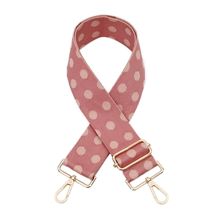 Adjustable wide replacement shoulder strap with pink polka dot pattern and gold hardware