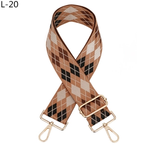 Detail of adjustable argyle jacquard strap with gold metal buckles for handbags