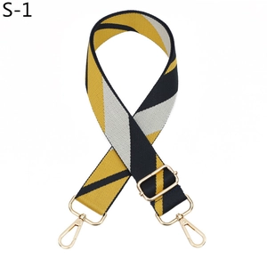 Detail showing adjustable gold-tone lobster clasps and geometric striped woven strap
