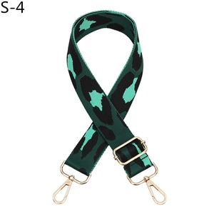 Detail of adjustable leopard print bag strap with golden metal lobster clasps