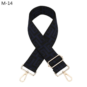 Detail showing the navy blue and black labyrinth jacquard weave on adjustable strap