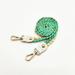 Colorful woven cotton rope strap with gold accents and leather ends for handbags