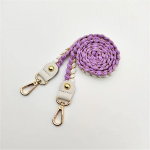 Woven purple and white rope bag strap with gold threads and metal lobster clasps