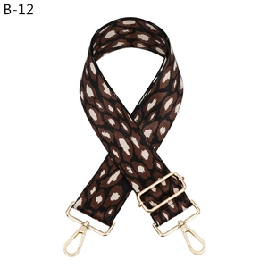 Detail view of leopard print wide replacement strap with golden metal lobster hooks