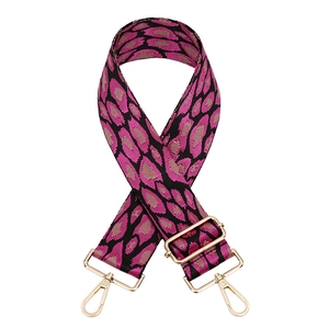Adjustable leopard print bag strap with pink accents and golden metal hooks