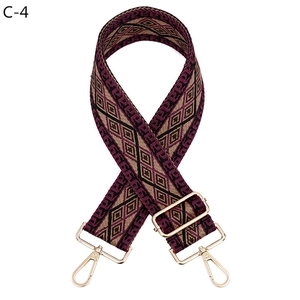 Adjustable woven shoulder strap with geometric diamond patterns and gold metal buckles