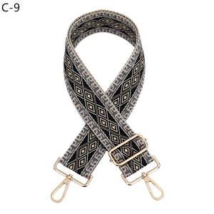 Detail of adjustable geometric diamond weave bag strap with gold metal lobster clasps
