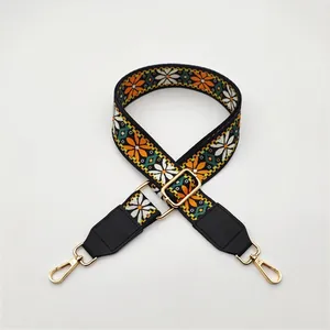Adjustable ethnic style bag strap with orange daisy patterns and gold lobster clasps