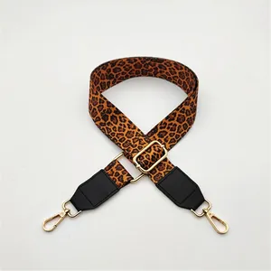 Close-up of Style 12 leopard print bag strap with black PU leather and gold metal clips