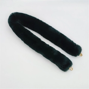 Detail of dark green faux fur bag strap with premium polished gold metal U-hooks
