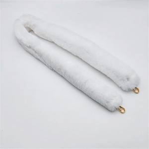 Detail of white faux fur replacement shoulder strap with gold metal lobster clasps