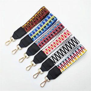 Six colorful wide replacement straps for handbags with geometric patterns and gold clips