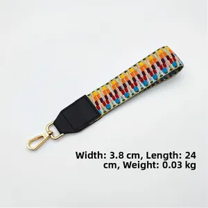 Ethnic style colorful braided bag strap with gold lobster clasp and leather reinforcement