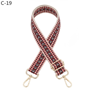 Adjustable woven replacement bag strap with ethnic red and blue patterns and gold hardware