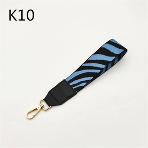 Detailed blue zebra pattern strap with black leather accents and a gold lobster clasp