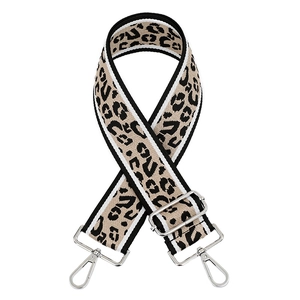 Adjustable leopard print bag strap with silver hardware and black-white striped edges