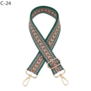 Detail of adjustable woven chevron strap with gold lobster clasps and geometric pattern