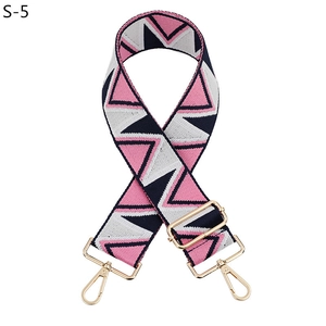 Detail of adjustable geometric triangle patterned strap with gold swivel lobster clasps