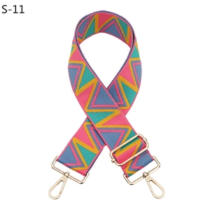 Detail of adjustable colorful woven strap with pink and yellow geometric wave patterns