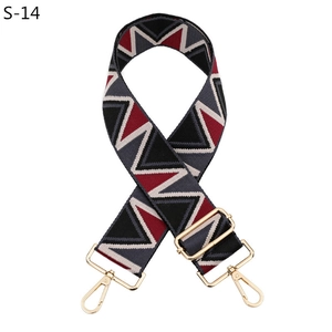 Adjustable woven shoulder strap with red and black geometric pattern and gold hardware
