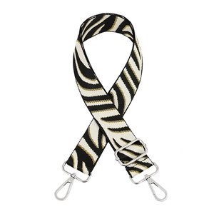 Adjustable woven zebra pattern shoulder strap with gold thread and silver metal buckles