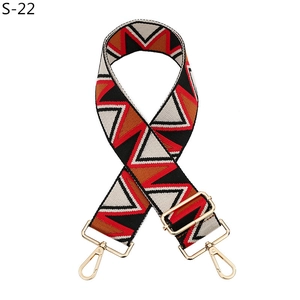 Close-up of geometric woven replacement strap with adjustable golden metal lobster clasps