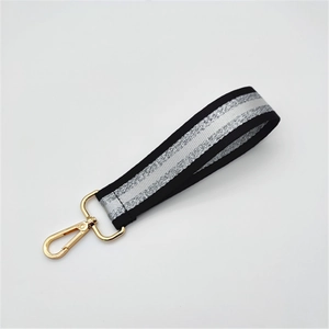 Short striped handbag strap in black and silver with polished gold lobster clasps