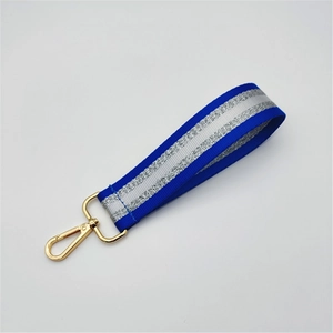 Navy blue woven wrist strap with silver glitter inlay and gold metal lobster clasp