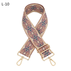 Close-up of diamond pattern jacquard woven guitar strap for crossbody bags with gold buckles