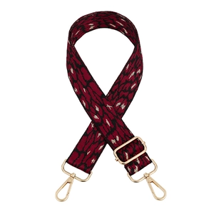 Close-up of leopard print shoulder strap with gold metallic threads and metal swivel hooks