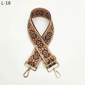 Detail of adjustable bohemian jacquard shoulder strap with golden metal hardware