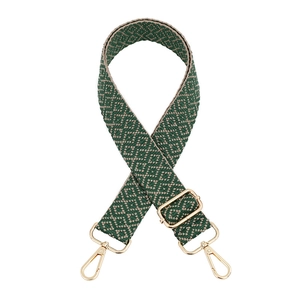 Detail view of woven diamond pattern bag strap with adjustable golden lobster clasps