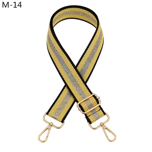 Adjustable woven shoulder strap in yellow and silver stripes with gold metal hooks