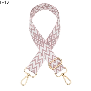 Detail view of pink and white diamond jacquard strap with polished gold metal buckles