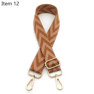 Adjustable woven shoulder strap for bags with brown wave pattern and gold lobster clasps
