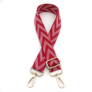 Adjustable red and white chevron jacquard bag strap with gold metal lobster clasps