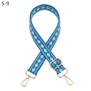 Adjustable blue woven strap with yellow diamond pattern and gold metal lobster clasps