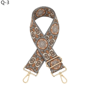 Detail of adjustable wide jacquard woven strap with vintage geometric floral pattern