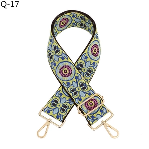 Detail of bohemian jacquard bag strap with adjustable champagne gold metal buckles