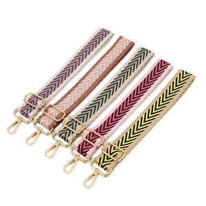 Thick jacquard woven adjustable purse straps in colorful chevron patterns with gold buckles
