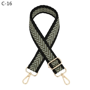 Detailed view of adjustable chevron woven strap with golden swivel lobster clasps