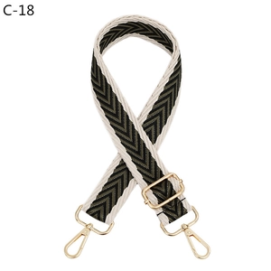 Detail of adjustable chevron woven strap with premium gold metal lobster clasps