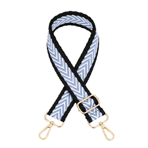 Adjustable wide replacement bag strap with blue and white herringbone pattern and gold hooks