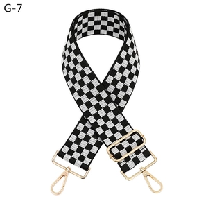 Adjustable wide replacement bag strap with black and white checkerboard weave and gold hardware