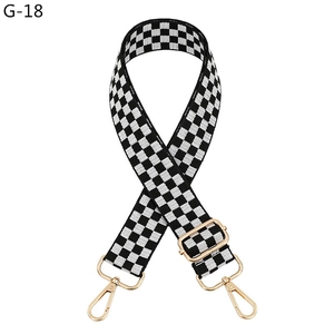 Adjustable black and white checkered bag strap with polished gold-tone metal hooks