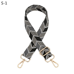 Detail of adjustable woven shoulder strap with black and white geometric arrow patterns