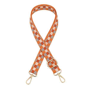 Adjustable checkerboard woven bag strap with orange and white patterns and gold metal buckles